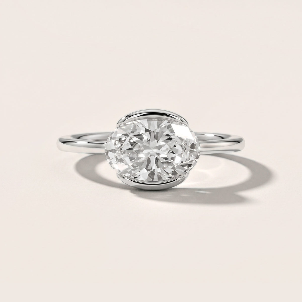 Mathilde East-West Half Bezel Oval Diamond Engagement Ring in White Gold - front.jpg