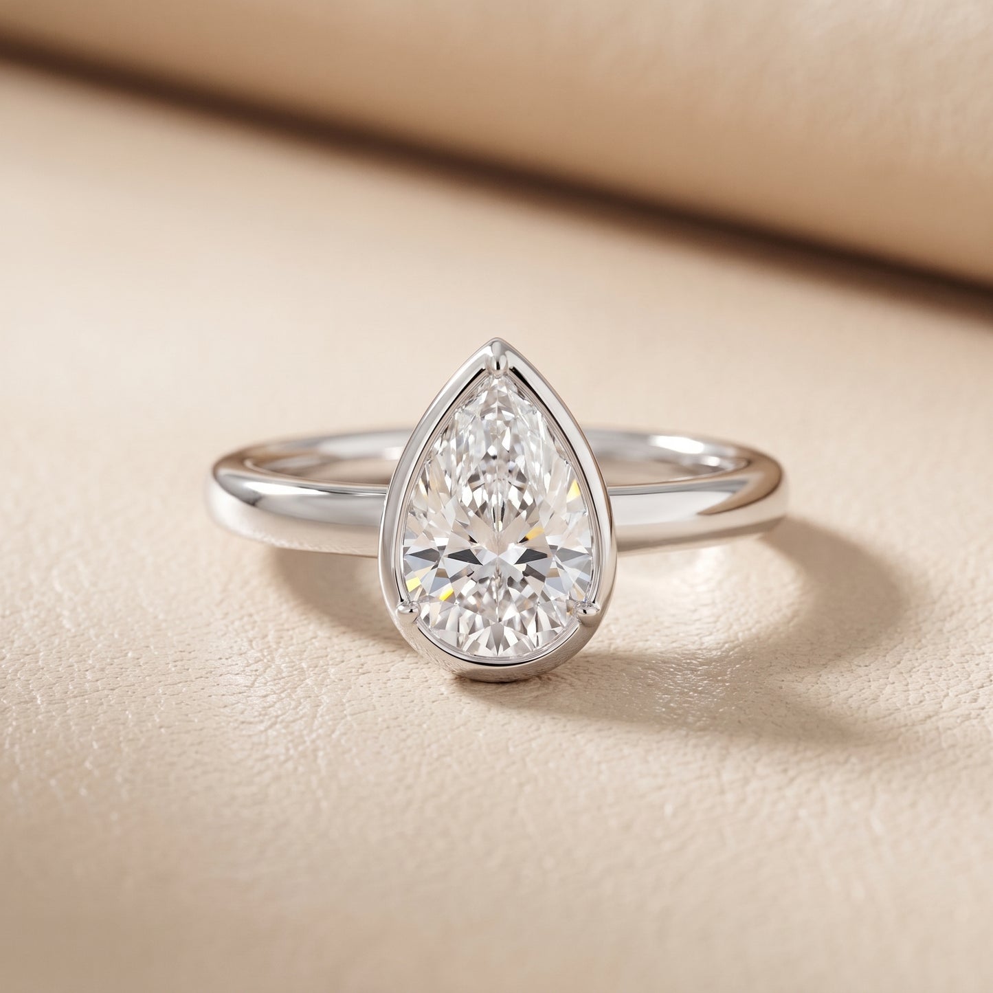 Alina Bezel Solitaire Pear Diamond Ring in White Gold - front.jpg