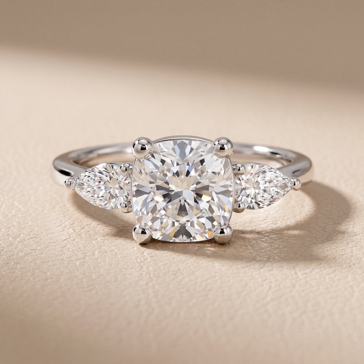 Faye Three-Stone Trellis Cushion Diamond Ring in Platinum - front.jpg