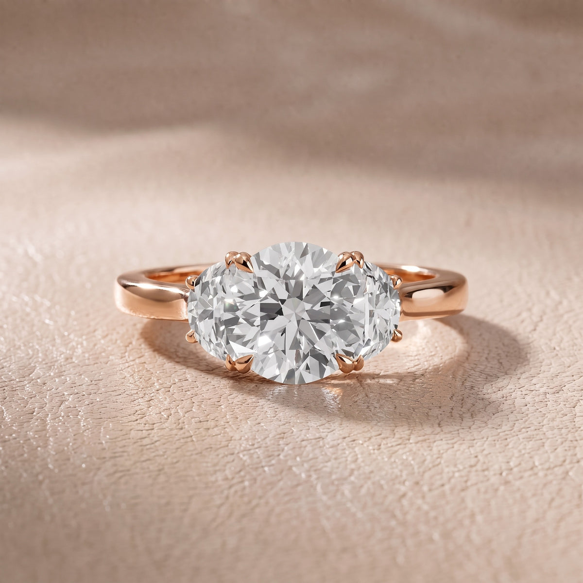 Romy Three-Stone Round Diamond Engagement Ring in Rose Gold - front.jpg