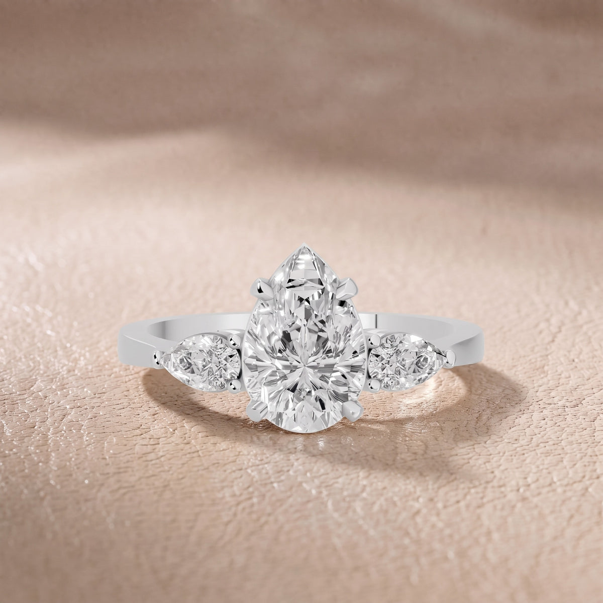 Grace Three Stone Pear Diamond Engagement Ring in Silver - front.jpg