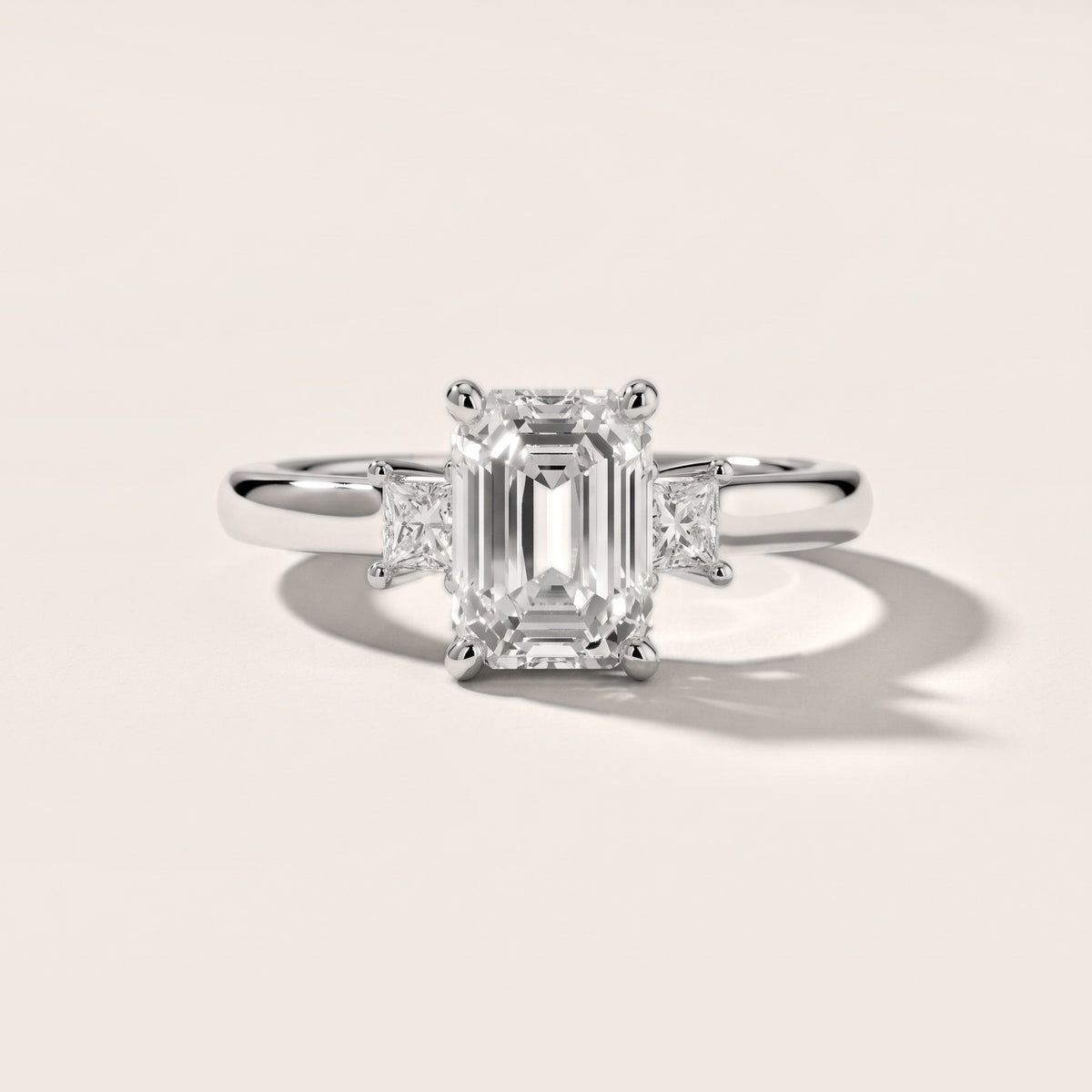 Brenna Three-Stone Emerald Diamond Engagement Ring in Silver - front.jpg