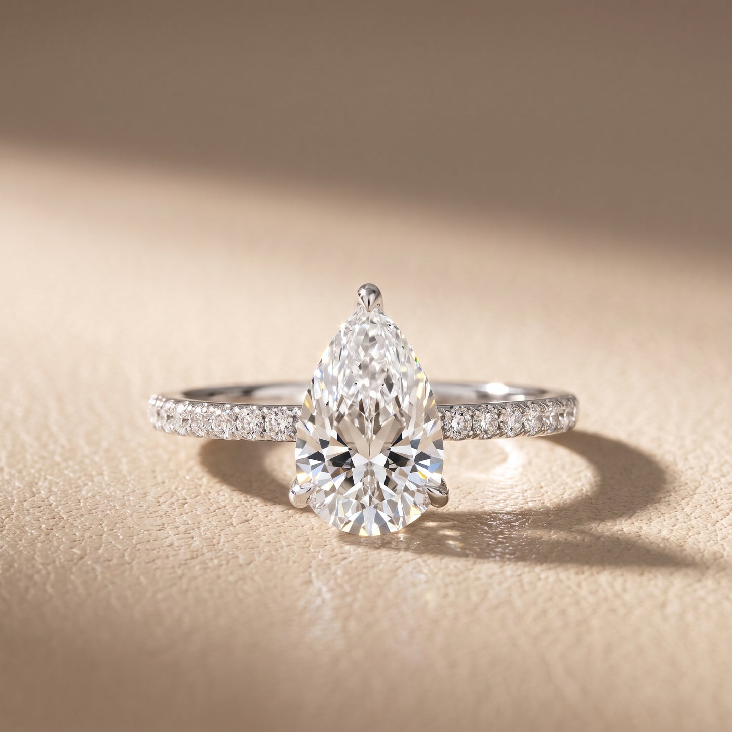 Ione Solitaire Pavé Pear Diamond Engagement Ring in White Gold - front.jpg