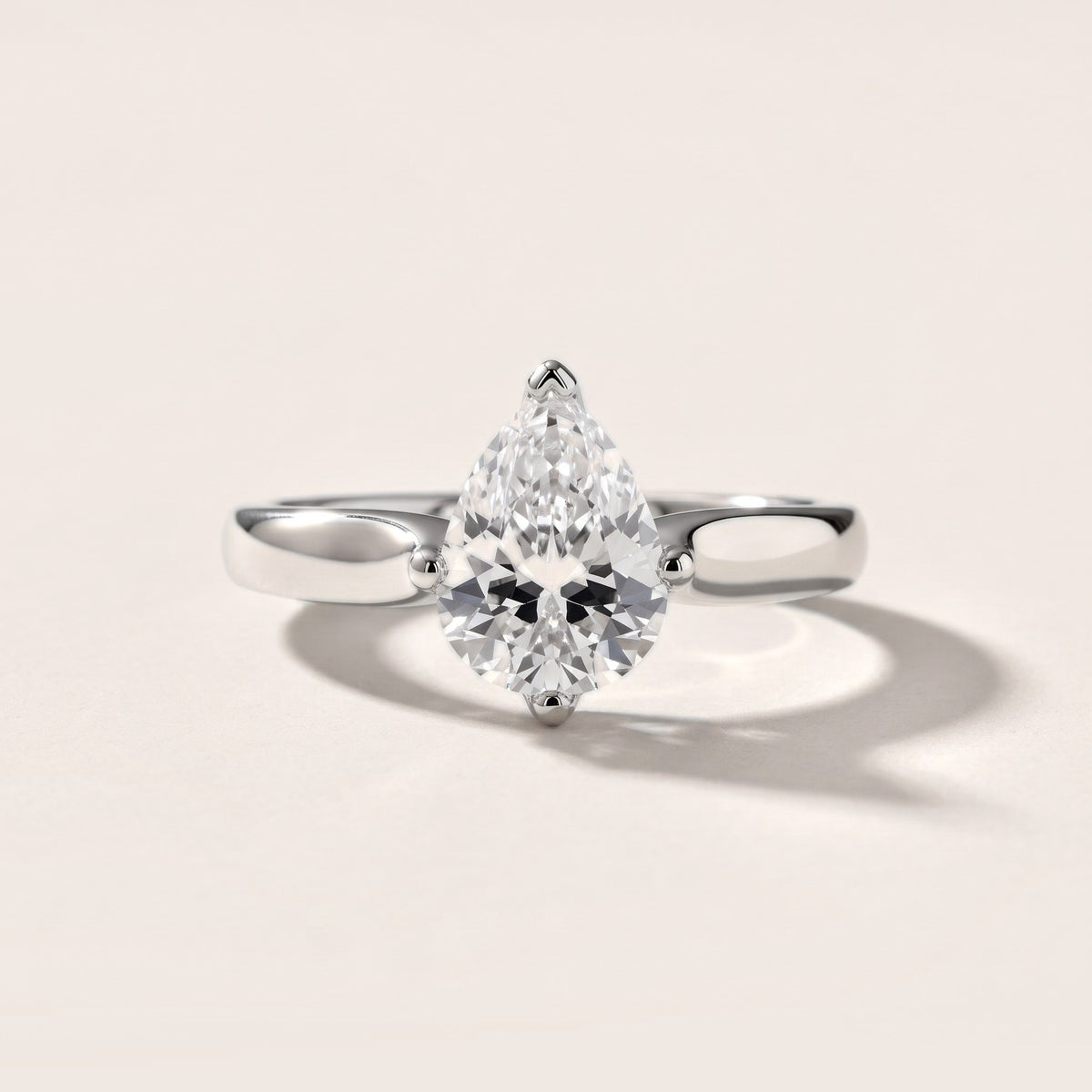Edwina Crossover Solitaire Pear Diamond Engagement Ring in Silver - front.jpg