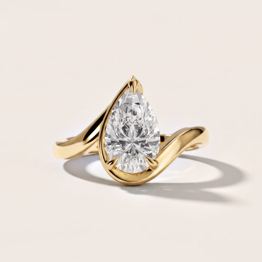 Margaux Bypass Solitaire Pear Diamond Engagement Ring in Yellow Gold