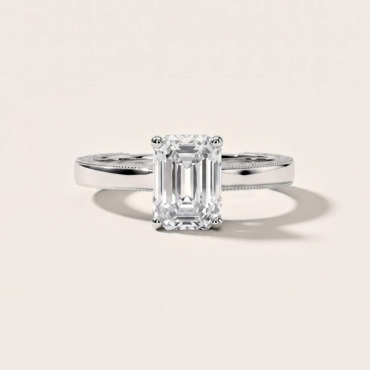 Kerry Engraved Solitaire Emerald Diamond Engagement Ring in Platinum - front.jpg