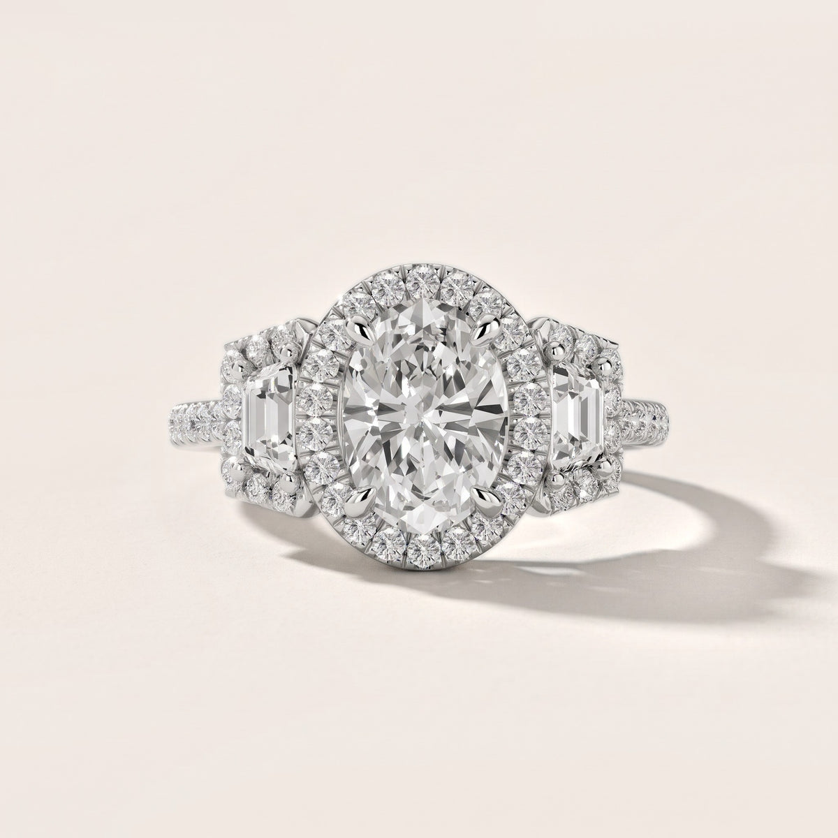 Paulina Three-Stone Halo Oval Diamond Engagement Ring in White Gold - front.jpg