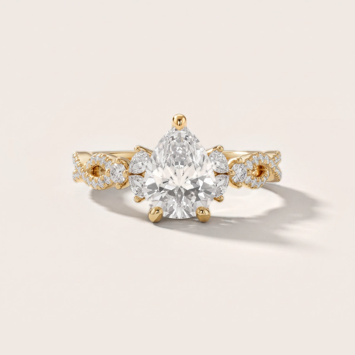 Neva Infinity Twist Pear Diamond Engagement Ring in Yellow Gold - front.jpg