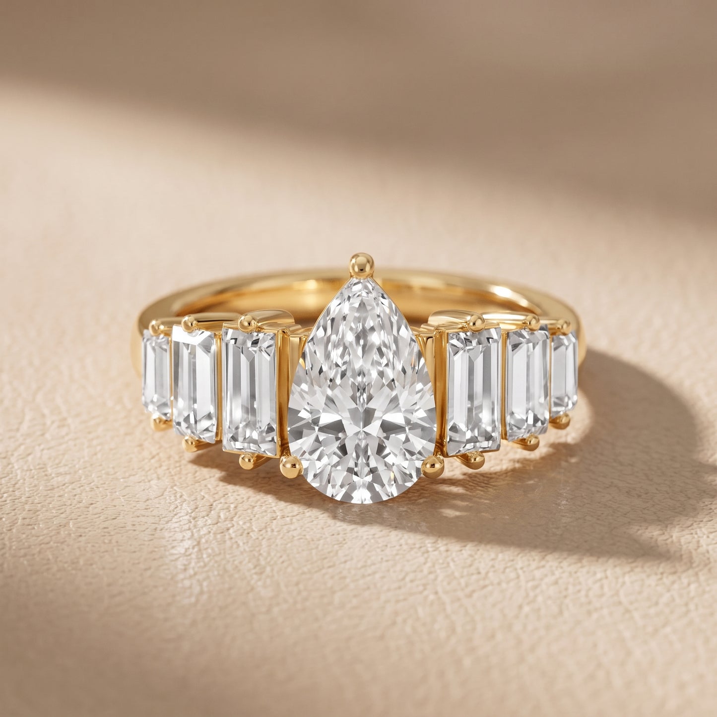 Mara Sidestone Baguette Accent Pear Diamond Engagement Ring in Yellow Gold - front.jpg