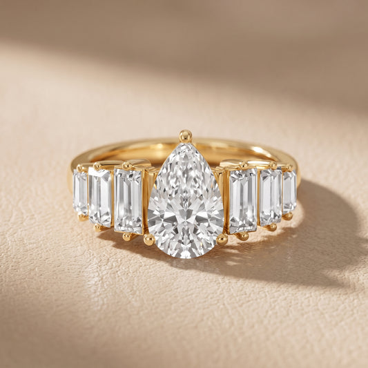 Mara Sidestone Baguette Accent Pear Diamond Engagement Ring in Yellow Gold - front.jpg