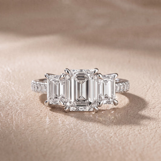 Gabrielle Three-Stone Pavé Emerald Diamond Engagement Ring in Platinum - front.jpg