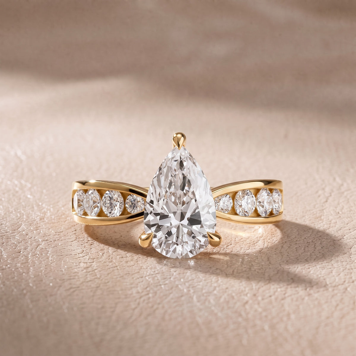 Rosalie Channel Set Sidestone Pear Diamond Engagement Ring in Yellow Gold - front.jpg