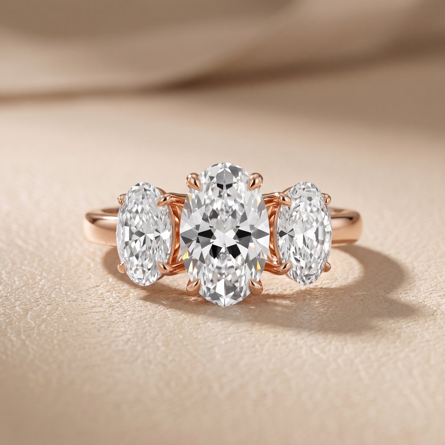 Lila Three-Stone Oval Diamond Ring in Rose Gold - front.jpg