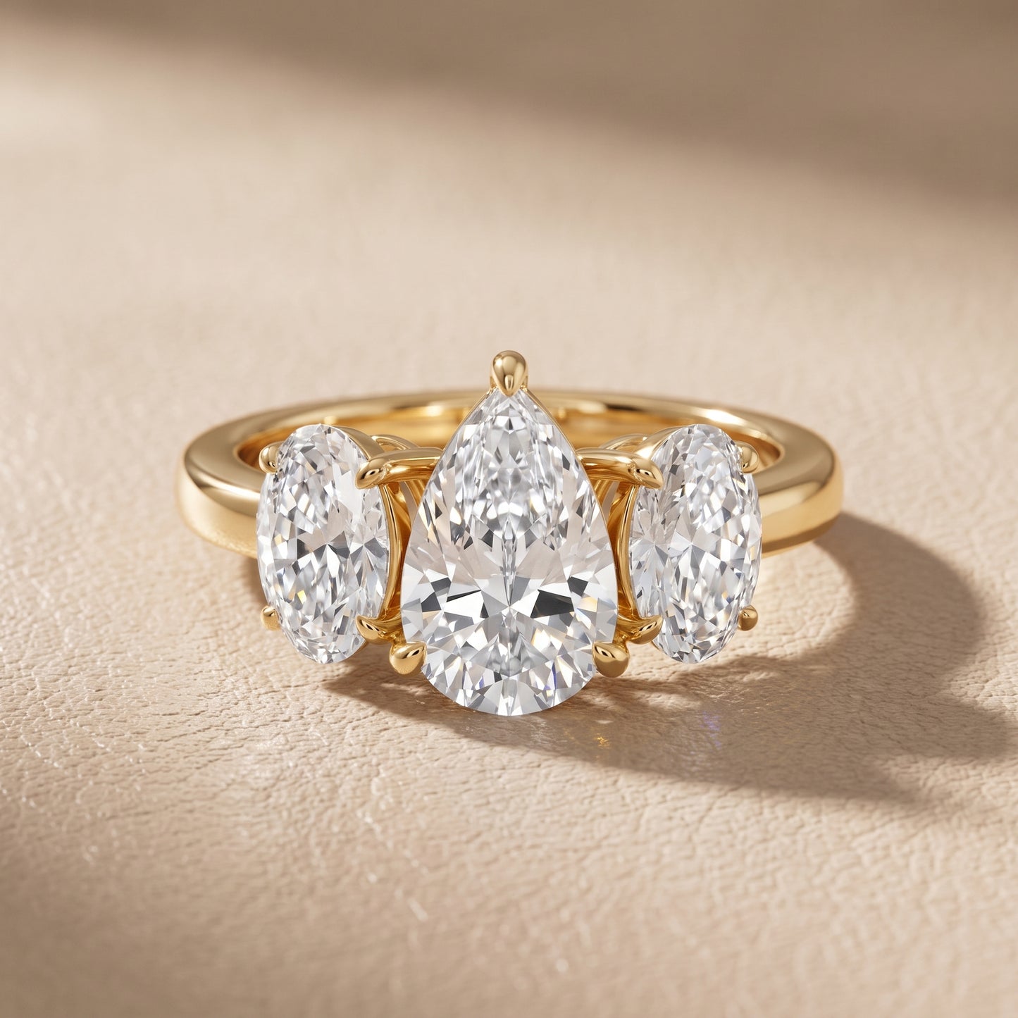 Lila Three-Stone Pear Diamond Ring in Yellow Gold - front.jpg