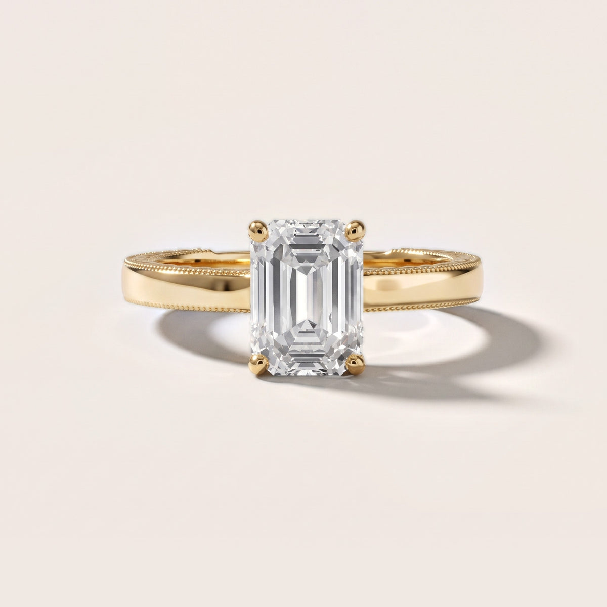 Kerry Engraved Solitaire Emerald Diamond Engagement Ring in Yellow Gold - front.jpg