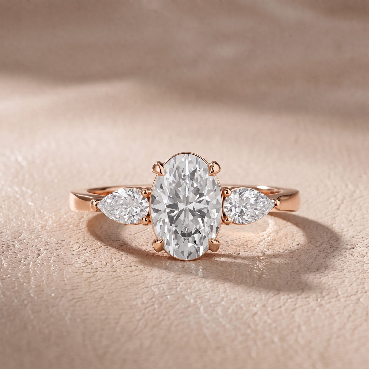 Grace Three Stone Oval Diamond Engagement Ring in Rose Gold - front.jpg
