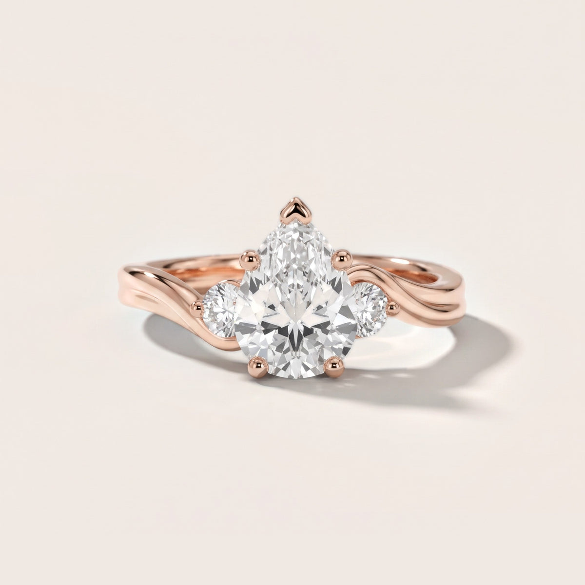 Rena Bypass Three-Stone Pear Diamond Engagement Ring in Rose Gold - front.jpg