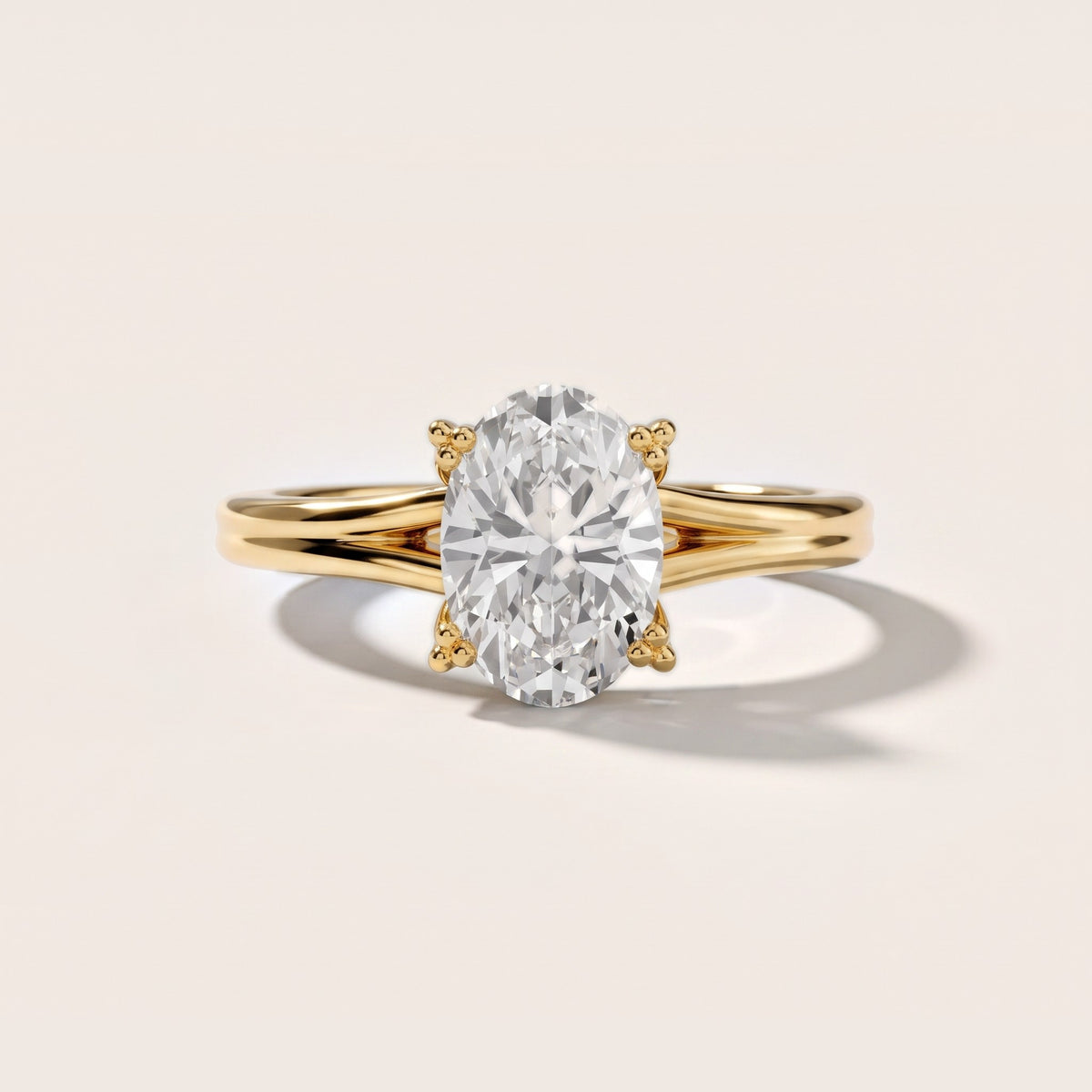 Neve Solitaire Split Shank Oval Diamond Engagement Ring in Yellow Gold - front.jpg