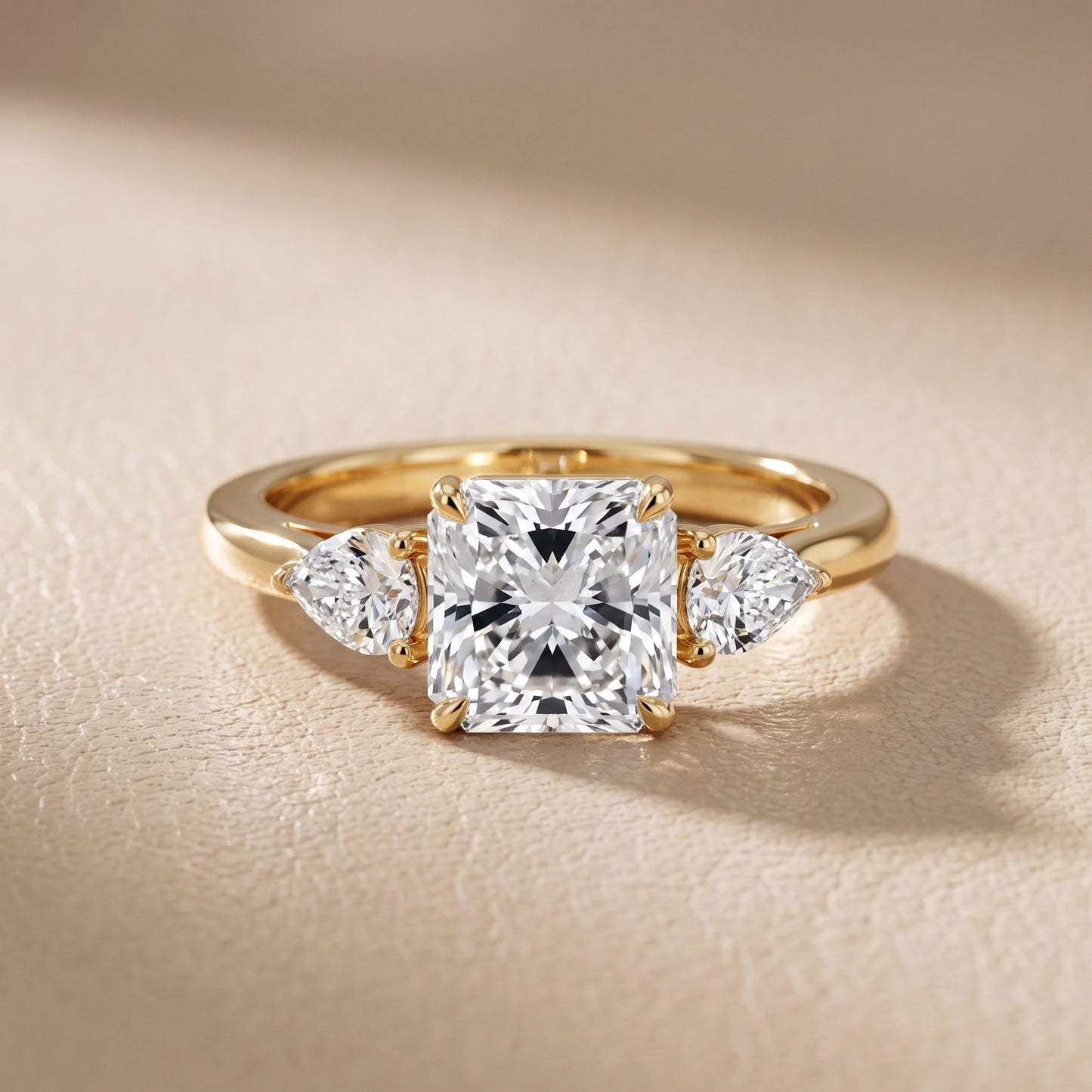 Phoebe Three-Stone Radiant Diamond Ring in Yellow Gold - front.jpg