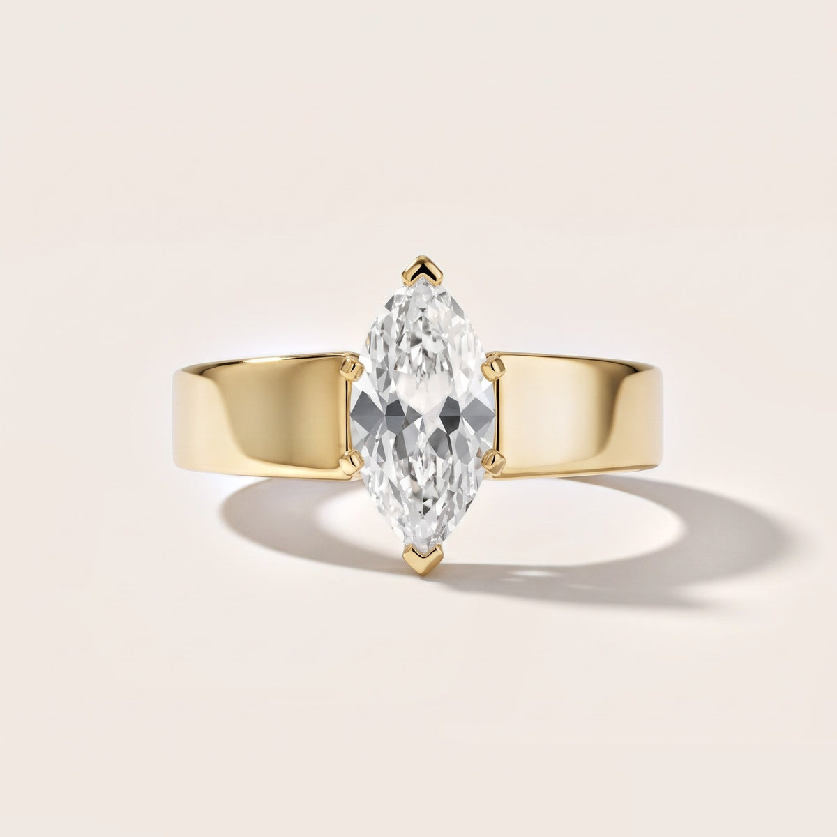 Susannah Wide Band Solitaire Marquise Diamond Engagement Ring in Yellow Gold - front.jpg