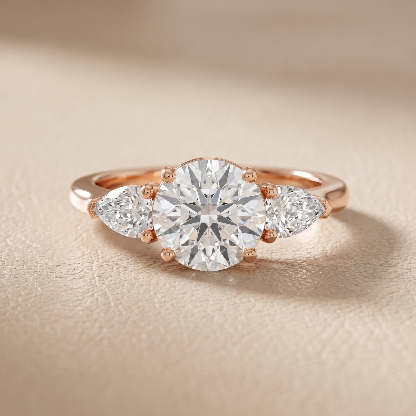 Mirabel Three-Stone Round Diamond Engagement Ring in Rose Gold - front.jpg