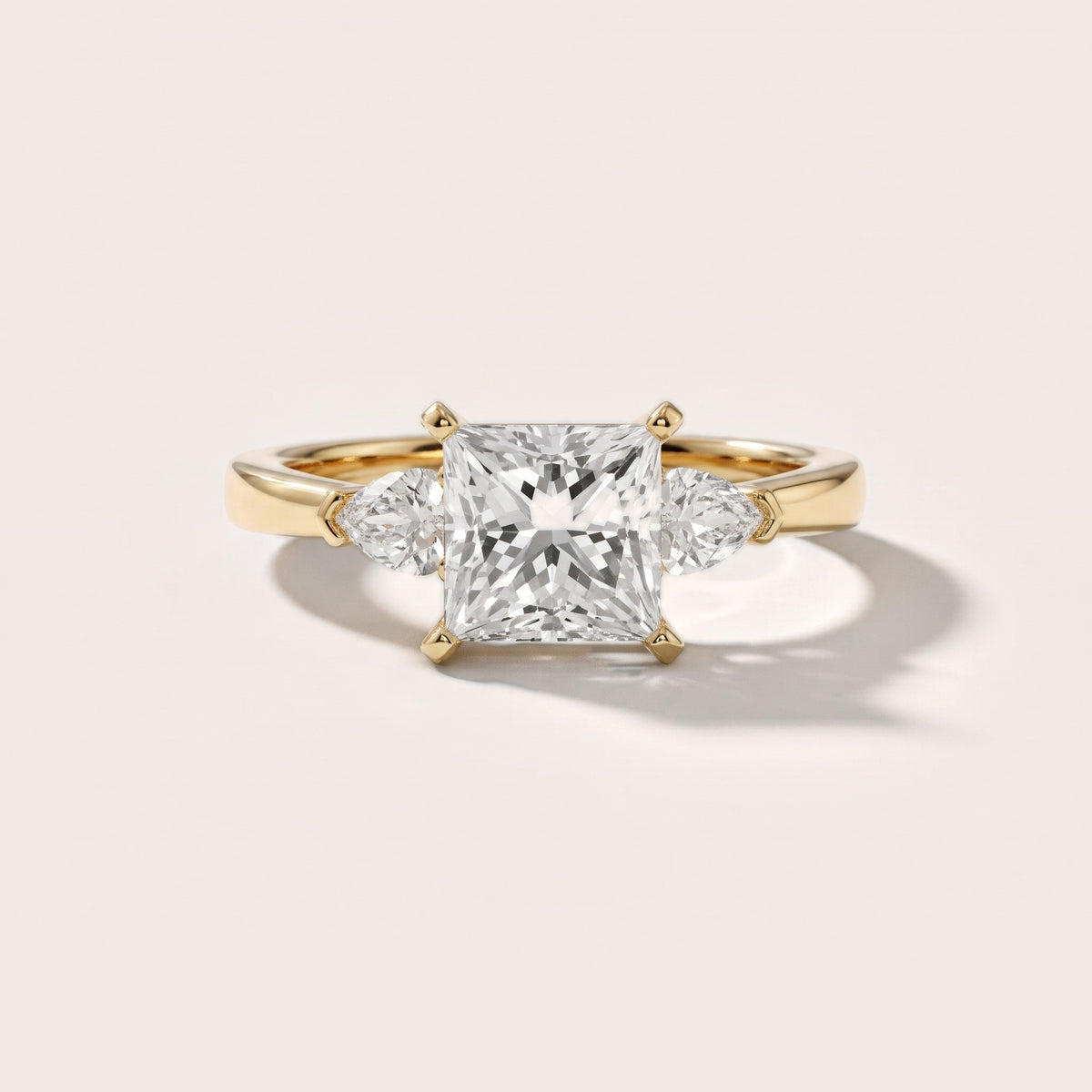 Amabel Three-Stone Princess Diamond Engagement Ring in Yellow Gold - front.jpg