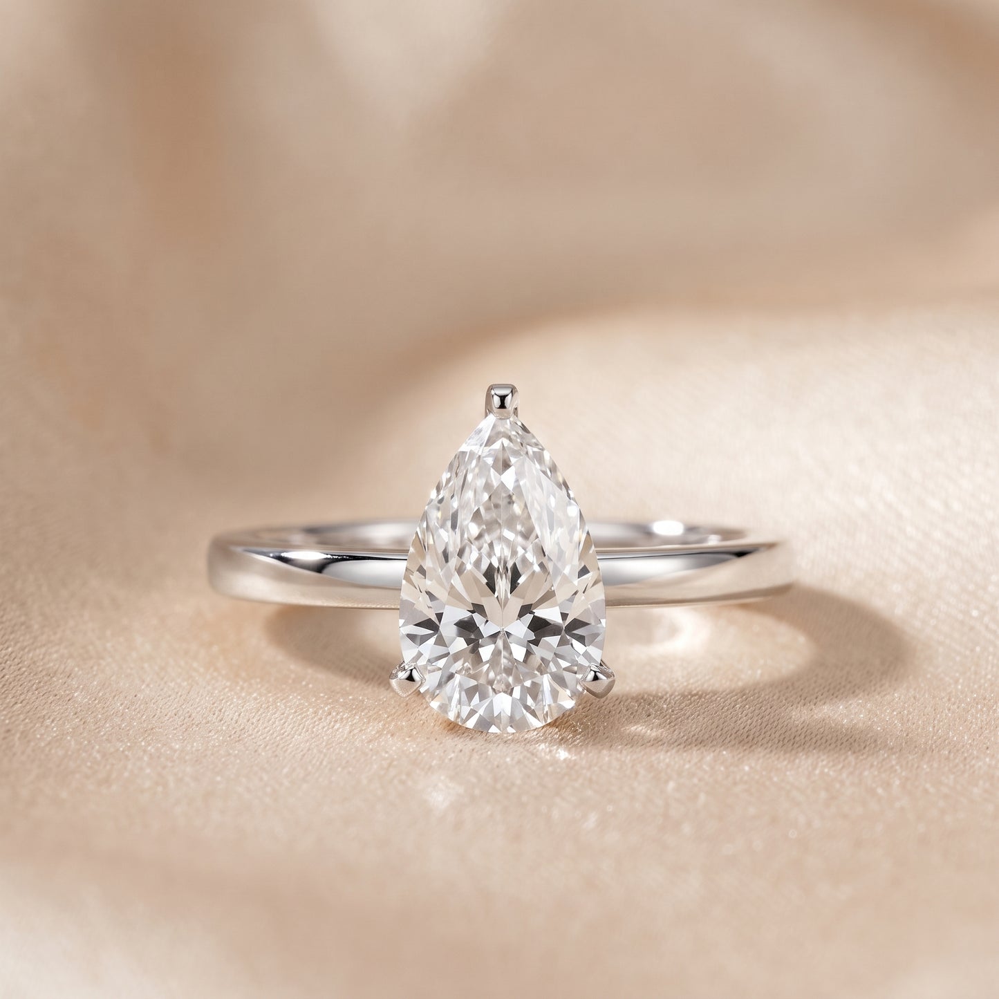 Liana Solitaire Claw Prong Pear Diamond Engagement Ring in Silver - front.jpg