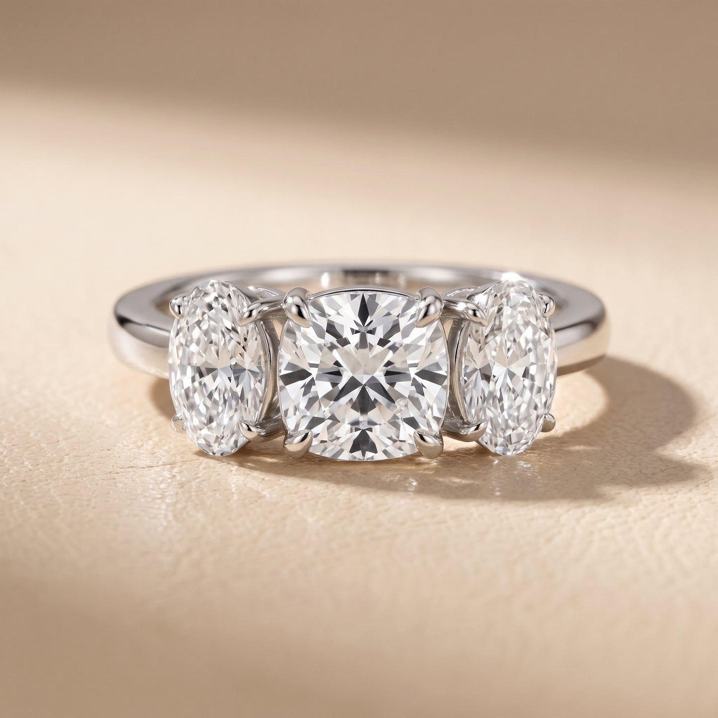 Lila Three-Stone Cushion Diamond Ring in Platinum - front.jpg