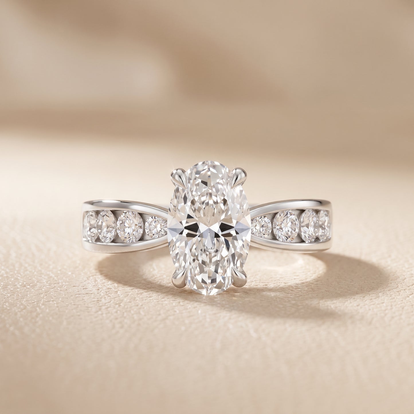 Noor Channel Set Sidestone Oval Diamond Engagement Ring in Platinum - front.jpg