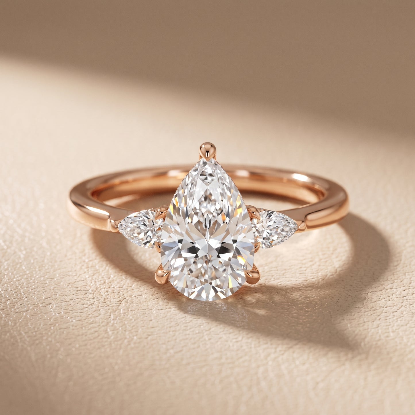 Leila Three-Stone Pear Diamond Engagement Ring in Rose Gold - front.jpg