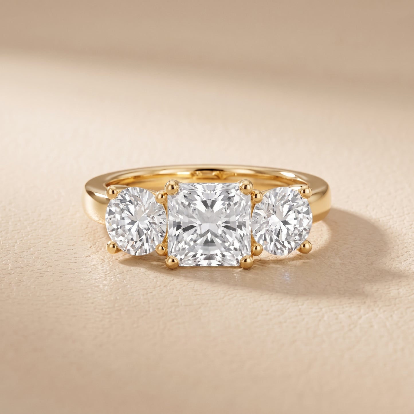 Callie Three-Stone Trellis Radiant Diamond Engagement Ring in Yellow Gold - front.jpg