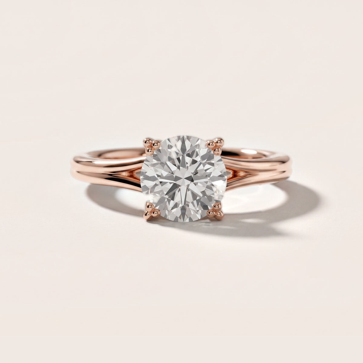 Neve Solitaire Split Shank Round Diamond Engagement Ring in Rose Gold - front.jpg