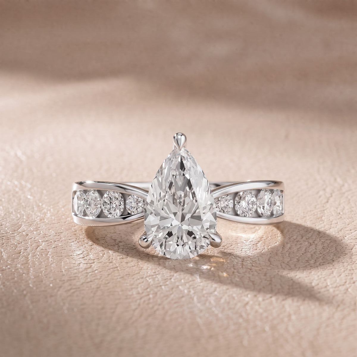 Rosalie Channel Set Sidestone Pear Diamond Engagement Ring in White Gold - front.jpg