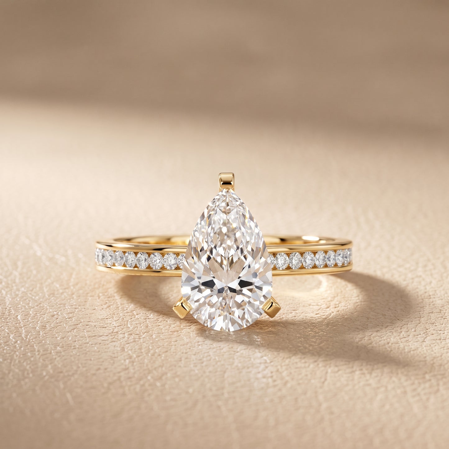 Tessa Solitaire Channel Set Pear Diamond Engagement Ring in Yellow Gold - front.jpg