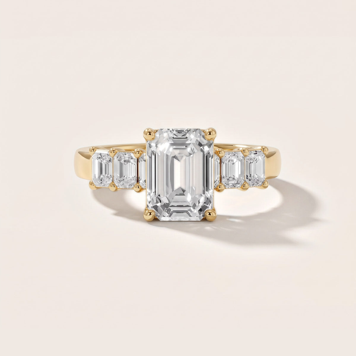 Lark Baguette Five-Stone Emerald Diamond Engagement Ring in Yellow Gold - front.jpg