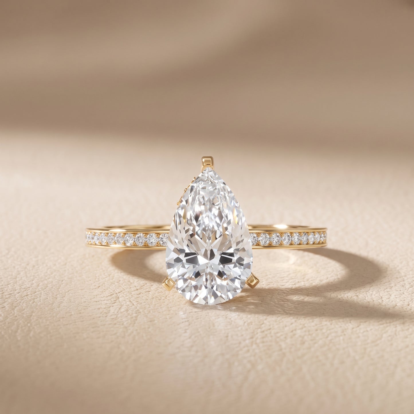 Naia Hidden Halo Pear Diamond Ring in Yellow Gold - front.jpg