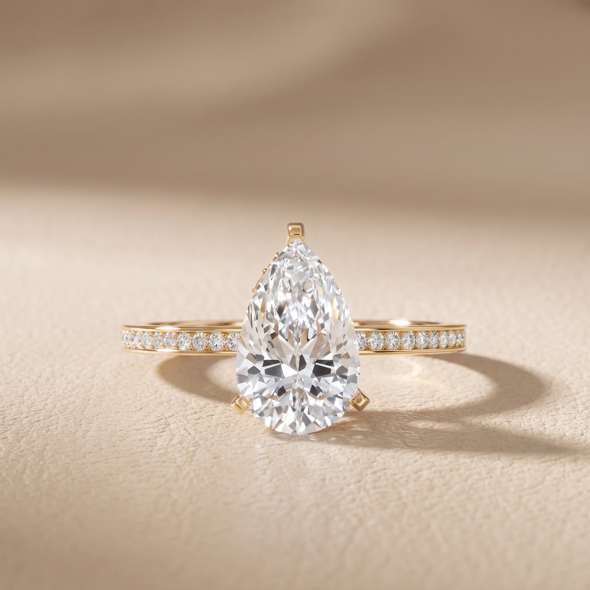 Naia Hidden Halo Pear Diamond Ring in Yellow Gold - front.jpg