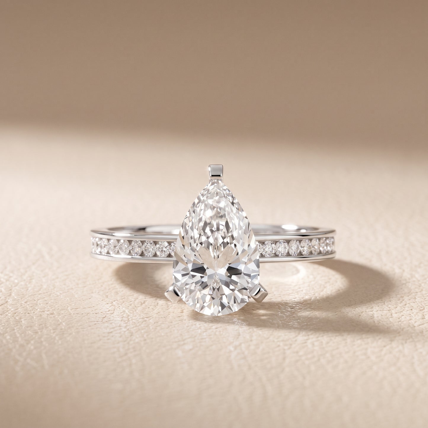 Tessa Solitaire Channel Set Pear Diamond Engagement Ring in Platinum - front.jpg