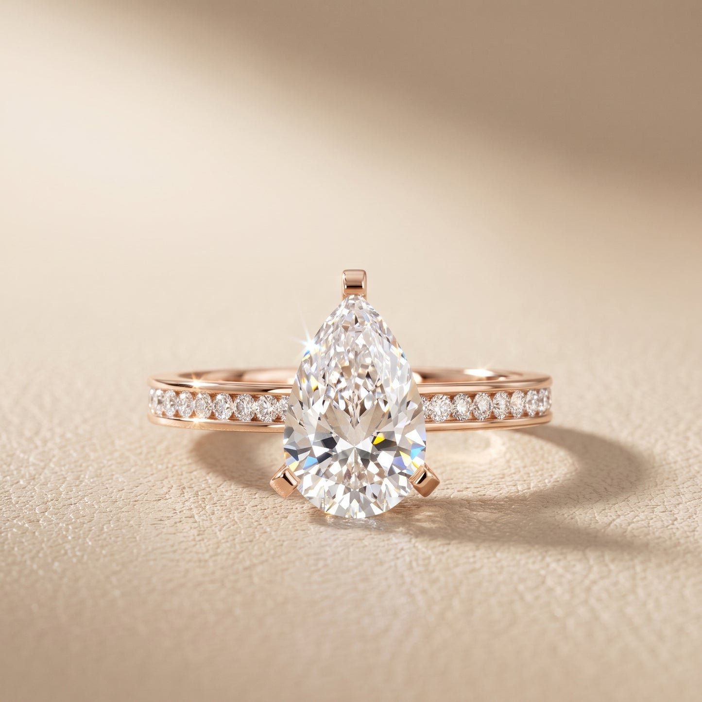 Tessa Solitaire Channel Set Pear Diamond Engagement Ring in Rose Gold - front.jpg