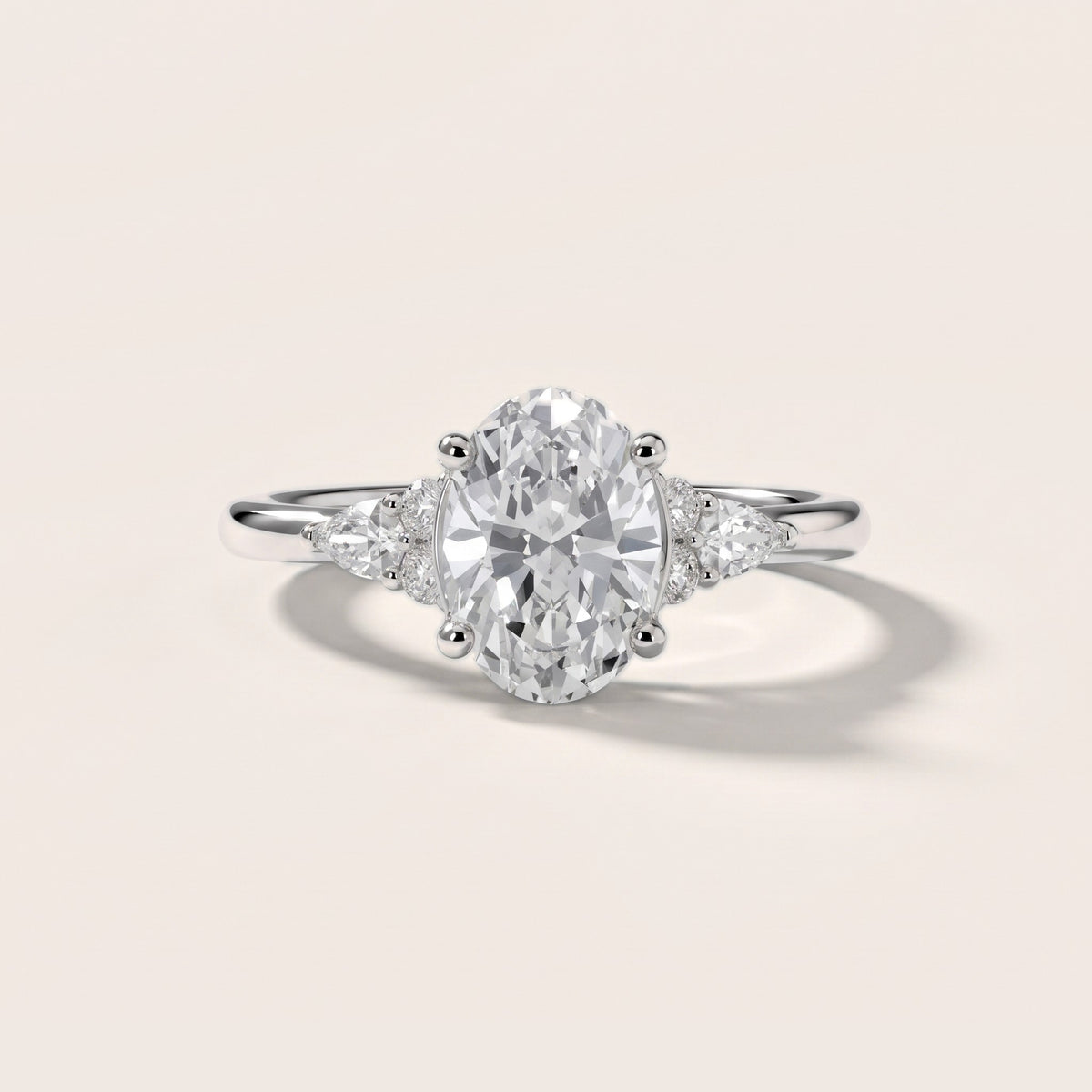 Zelie Pear-Side Cluster Oval Diamond Engagement Ring in White Gold - front.jpg