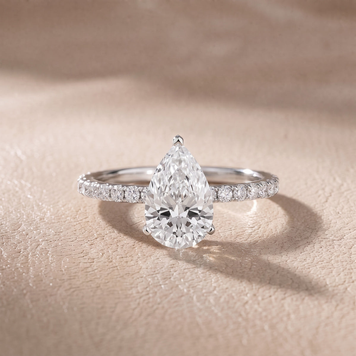 Juna French Pavé Solitaire Pear Diamond Engagement Ring in Platinum - front.jpg