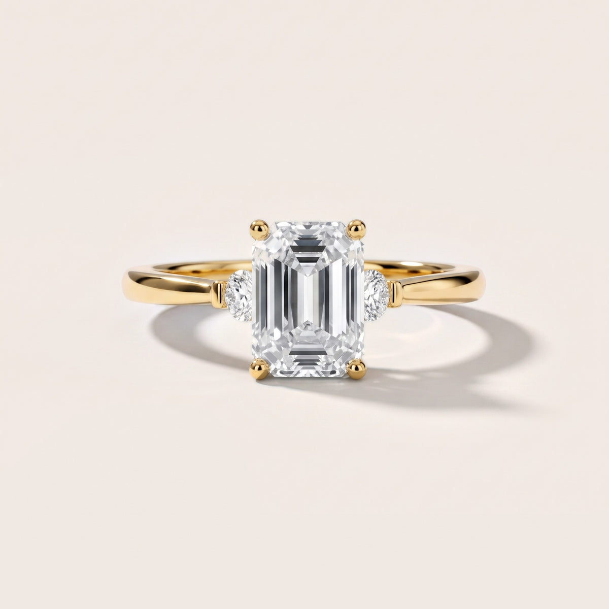 Micaela Three-Stone Emerald Diamond Engagement Ring in Yellow Gold - front.jpg