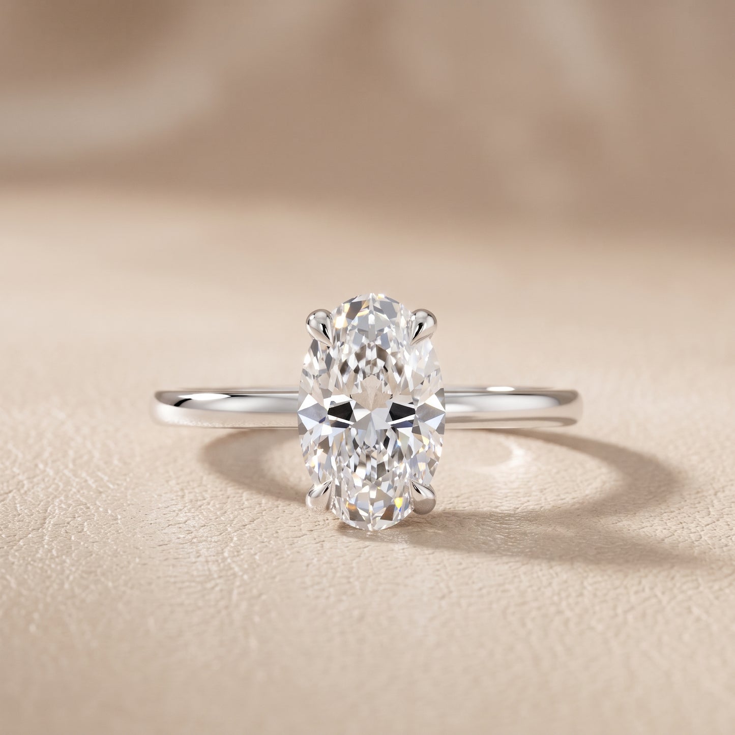 Nella Petite Solitaire Oval Diamond Engagement Ring in Platinum - front.jpg