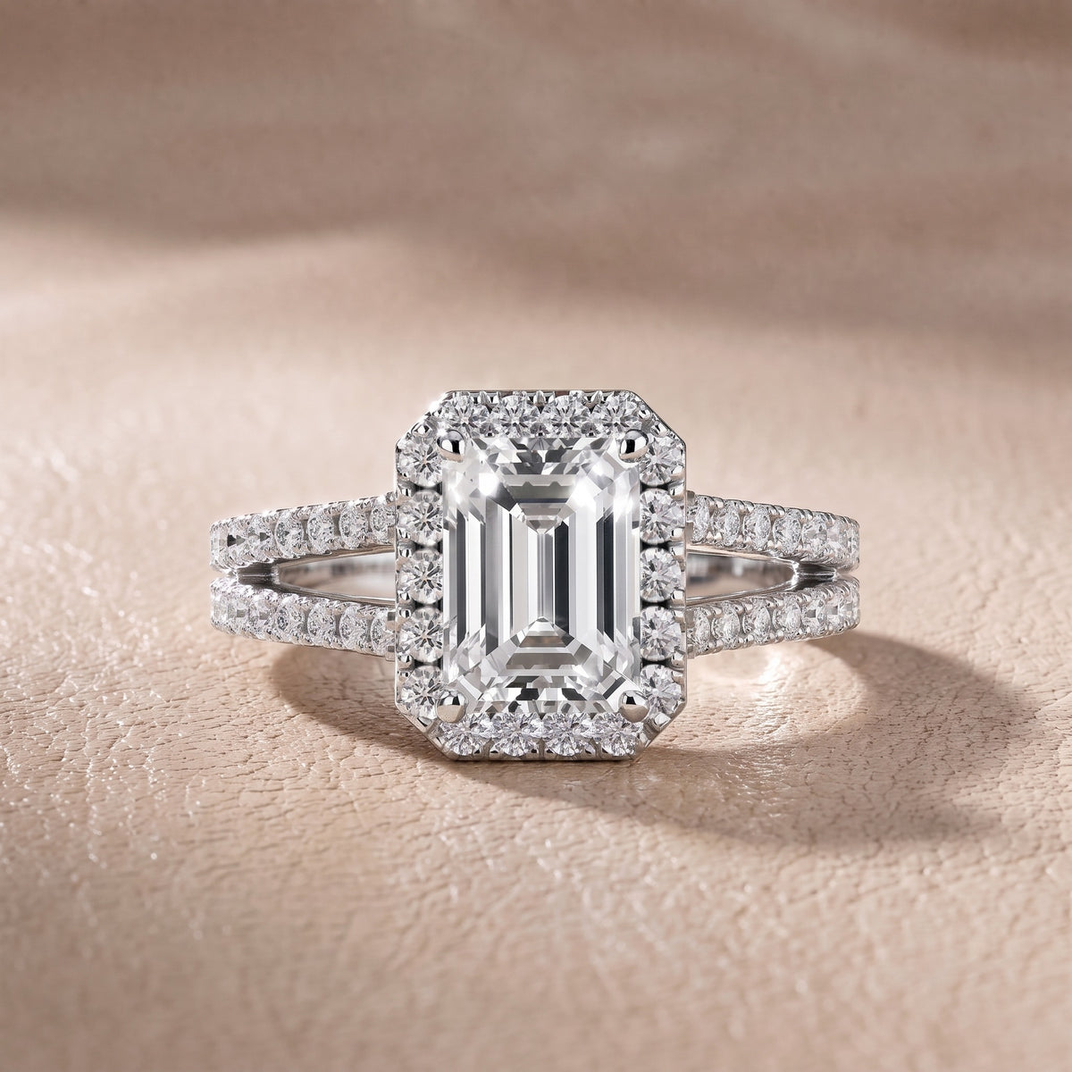 Kira Halo Split Shank Emerald Diamond Engagement Ring in Platinum - front.jpg