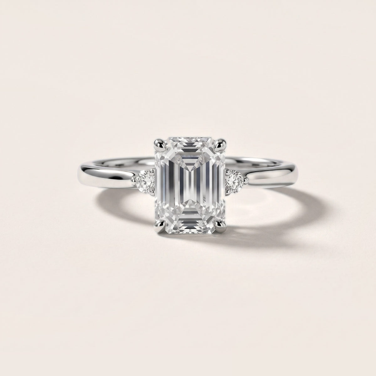 Teodora Floating Three-Stone Emerald Diamond Engagement Ring in White Gold - front.jpg