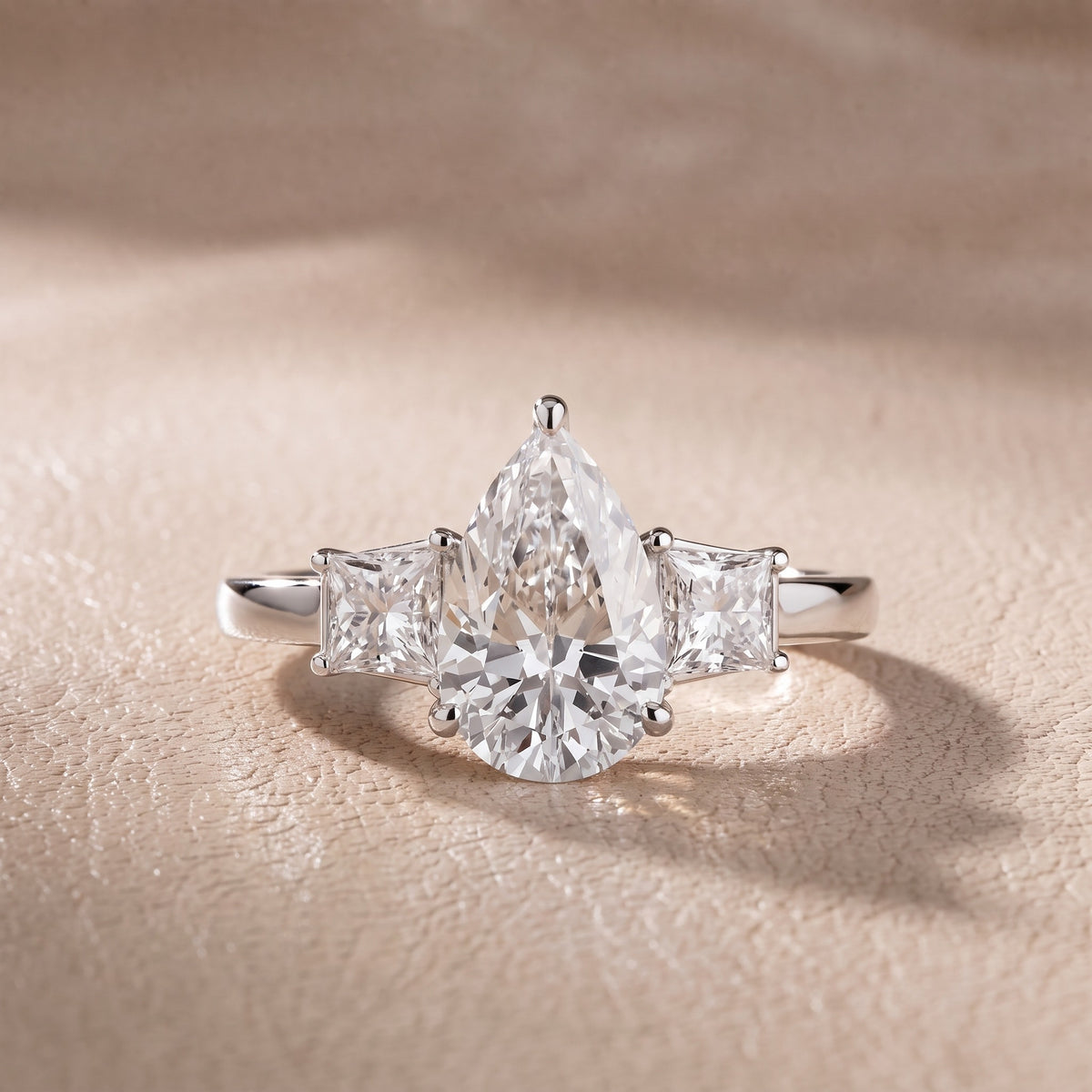 Aria Three-Stone Basket Pear Diamond Engagement Ring in Silver - front.jpg