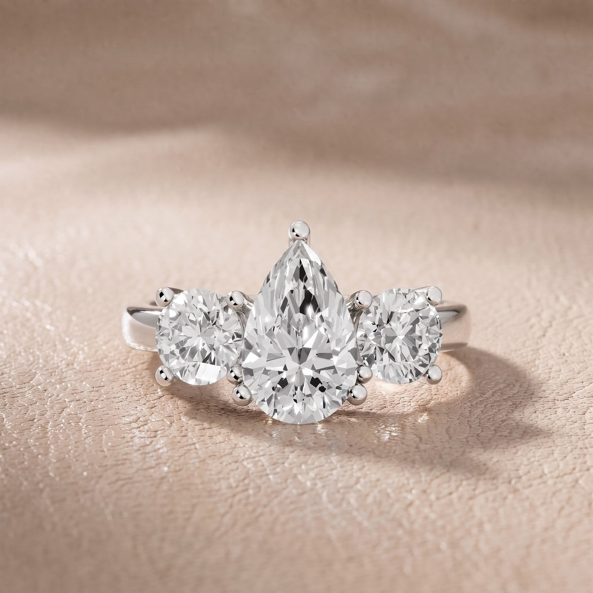 Callie Three-Stone Trellis Pear Diamond Engagement Ring in Silver - front.jpg