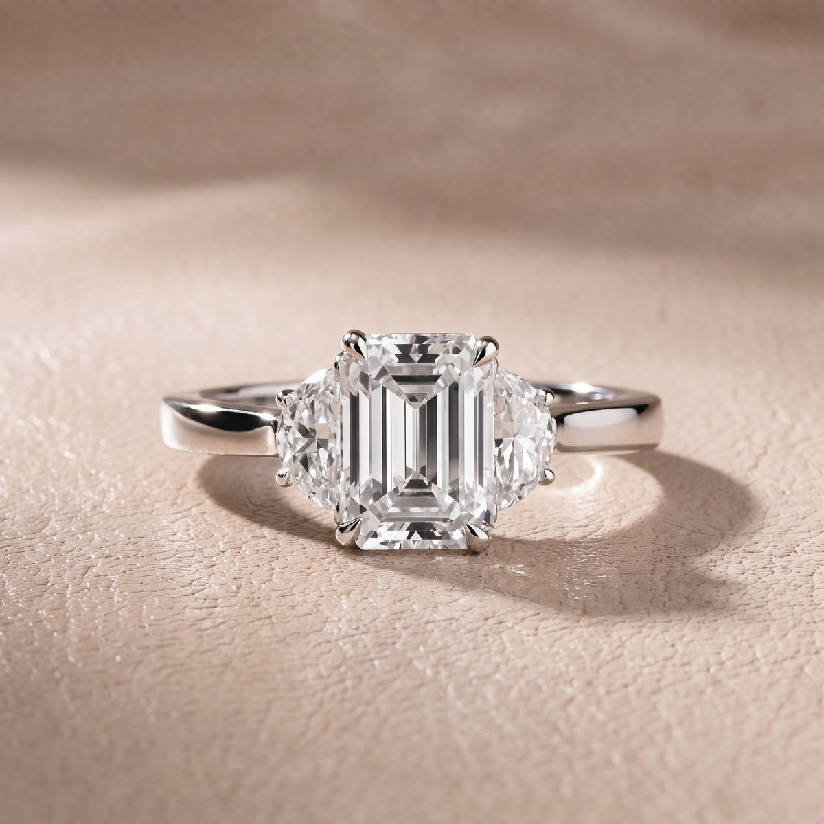 Romy Three-Stone Emerald Diamond Engagement Ring in Platinum - front.jpg