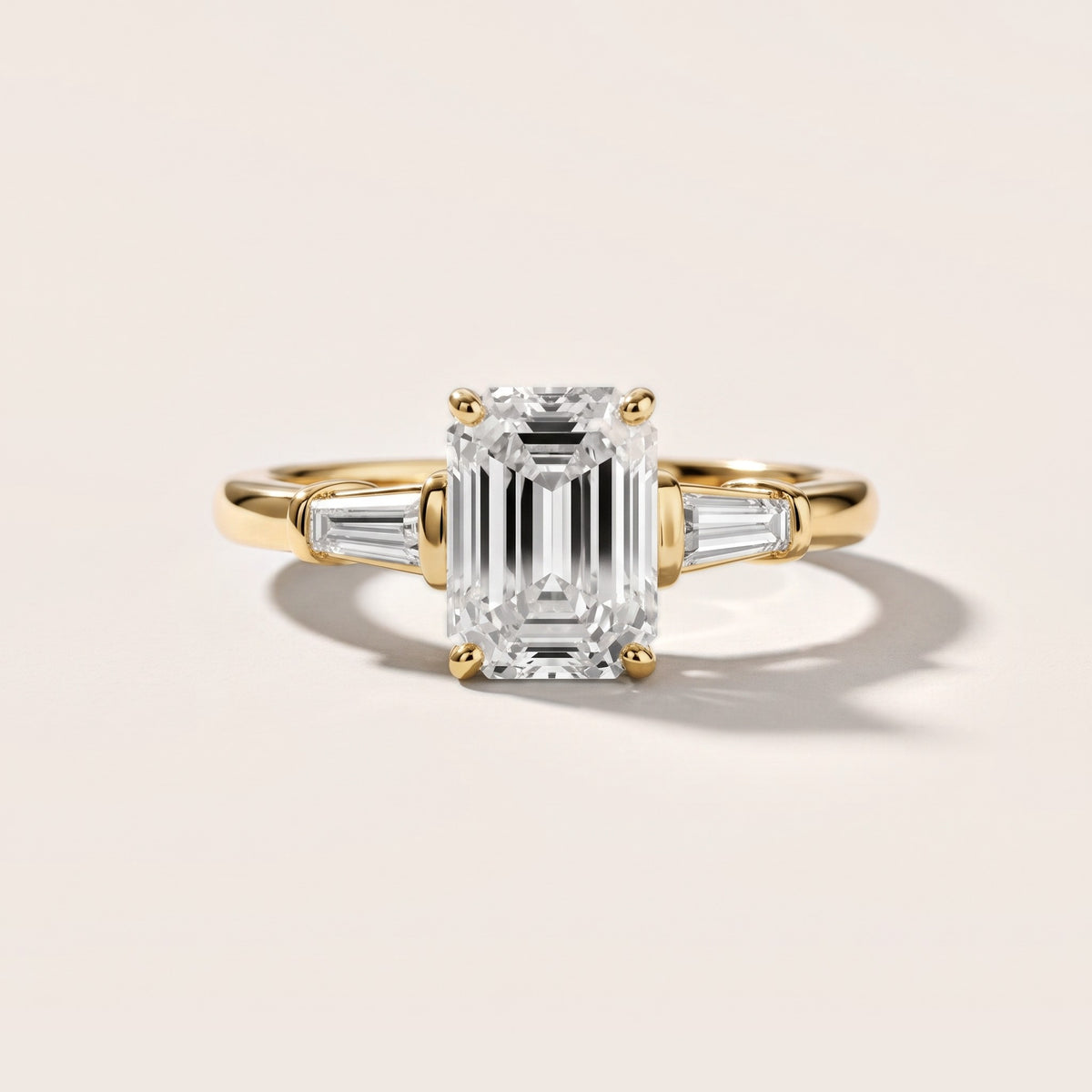Abby Baguette Three-Stone Emerald Diamond Engagement Ring in Yellow Gold - front.jpg
