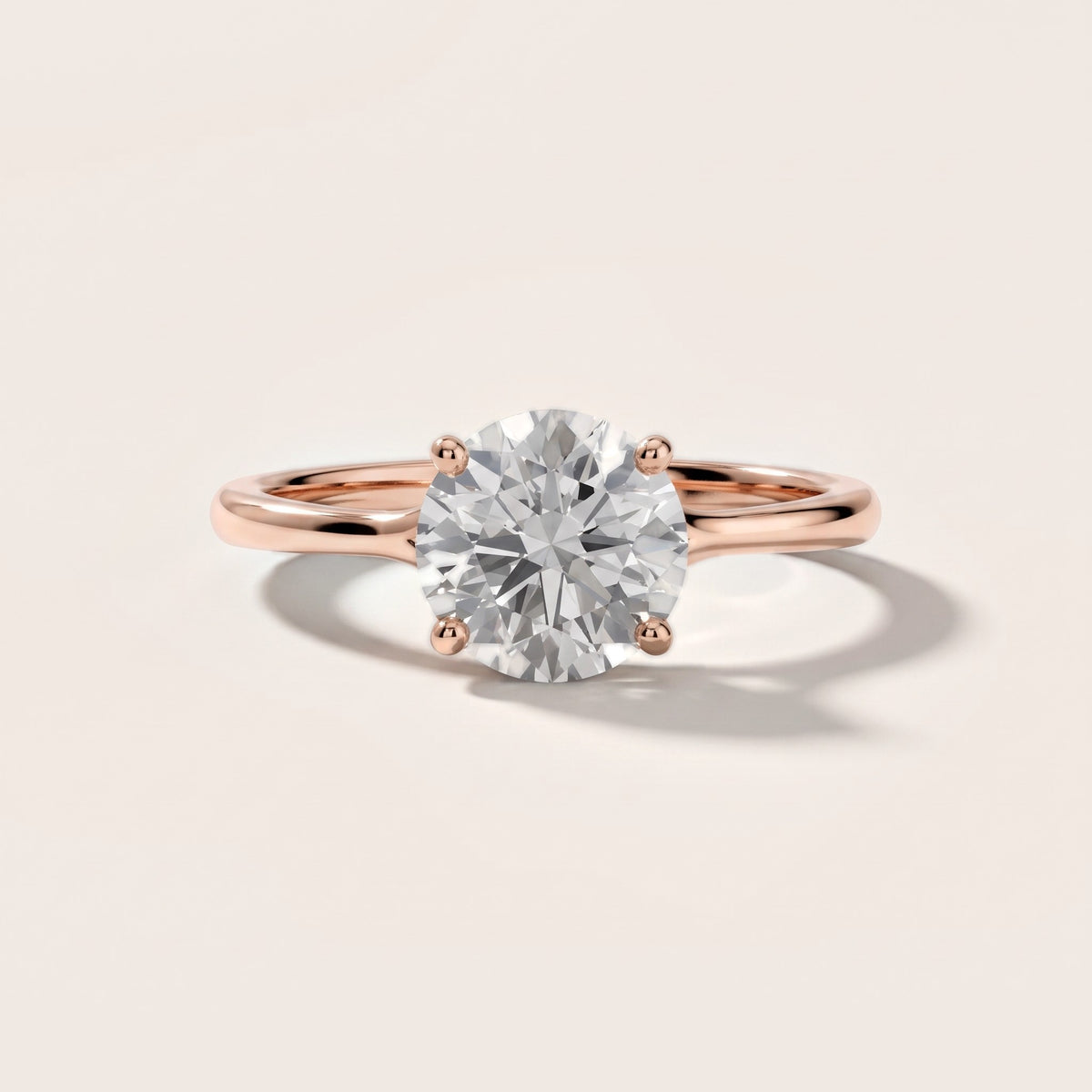 Blanche Solitaire Split Shank Round Diamond Engagement Ring in Rose Gold - front.jpg